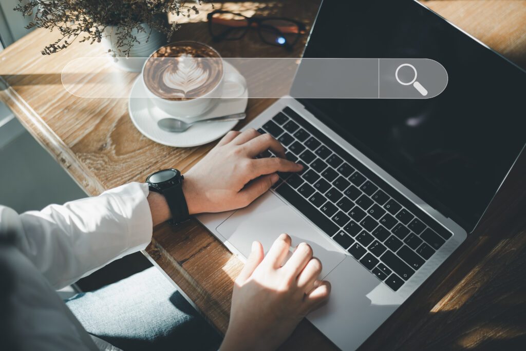 man searching laptop